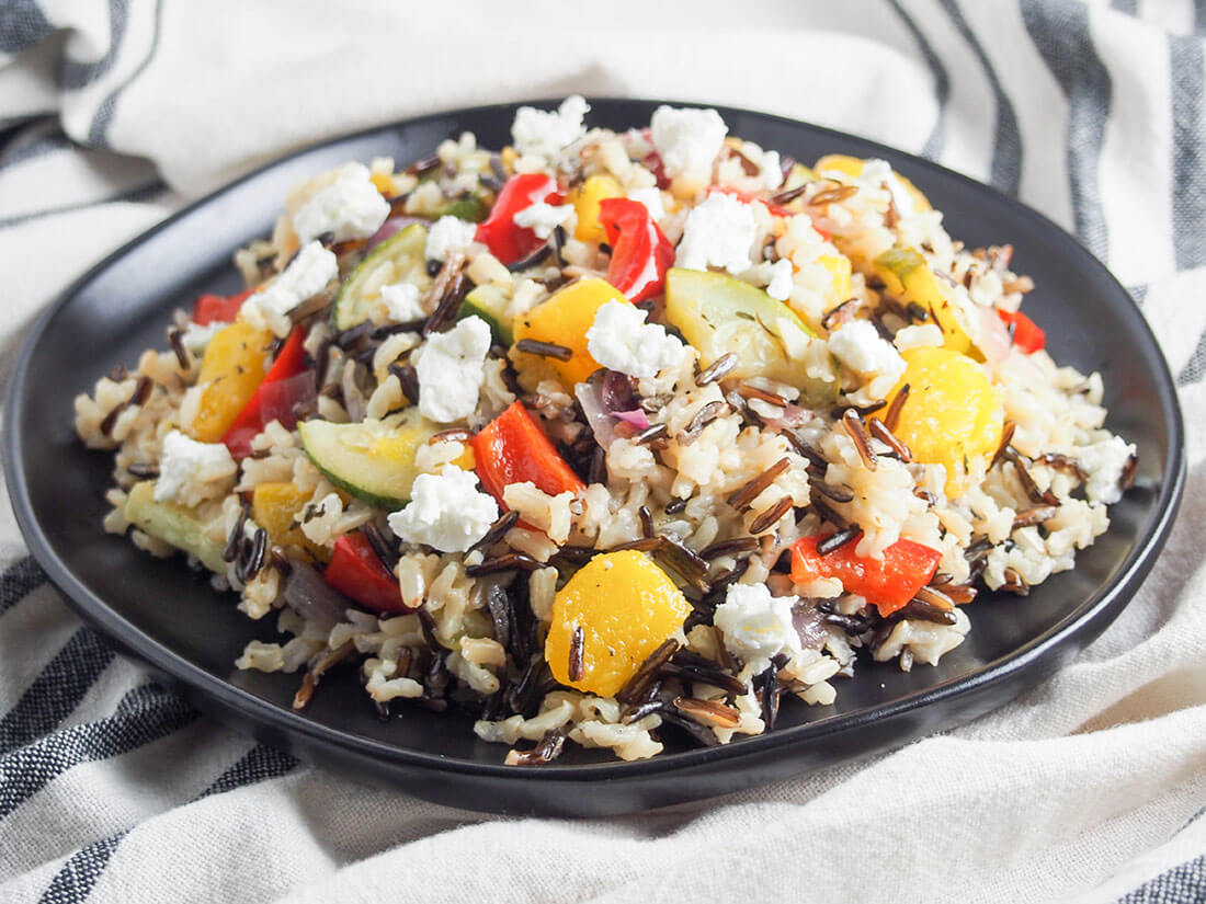 acorn squash wild rice salad on black plate