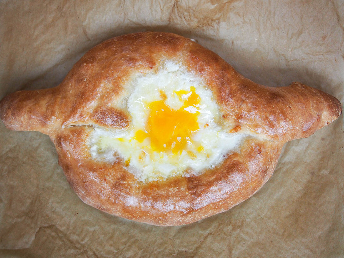 whole Adjaruli khachapuri Georgian cheese bread from overhead