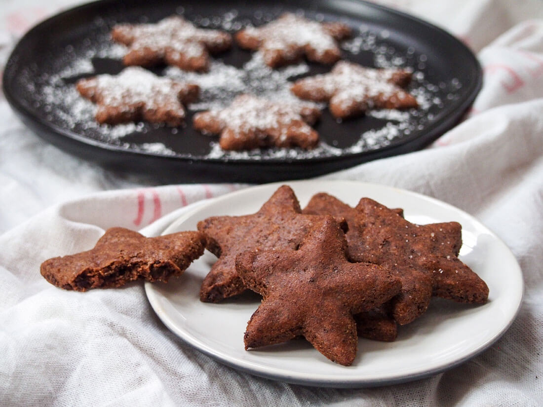 Basler brunsli (Swiss chocolate almond cookies) on large and small plates