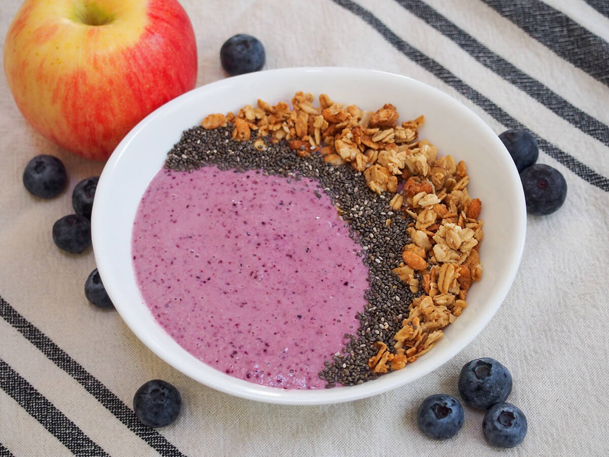 side view of bowl of blueberry apple smoothie