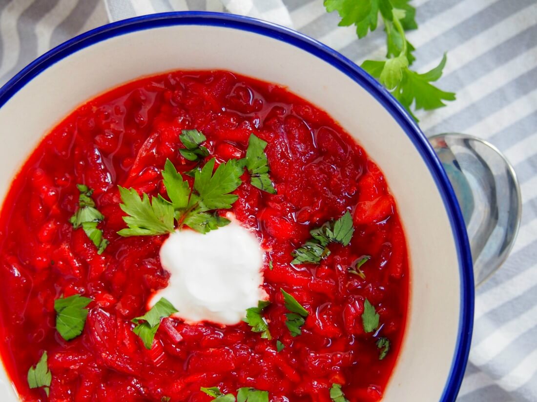 partial view of bowl of borscht