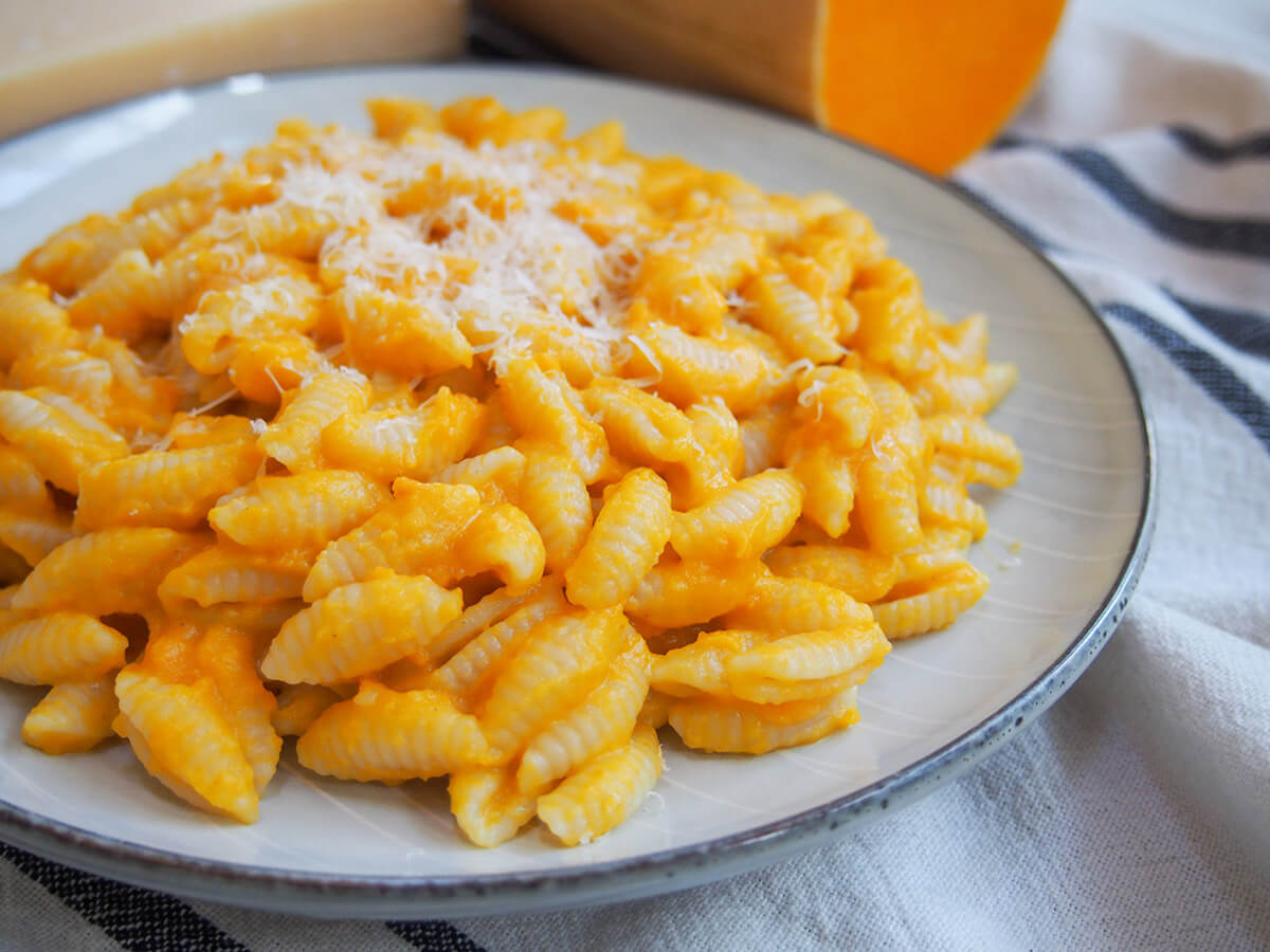 plate of pasta coated with butternut squash pasta sauce