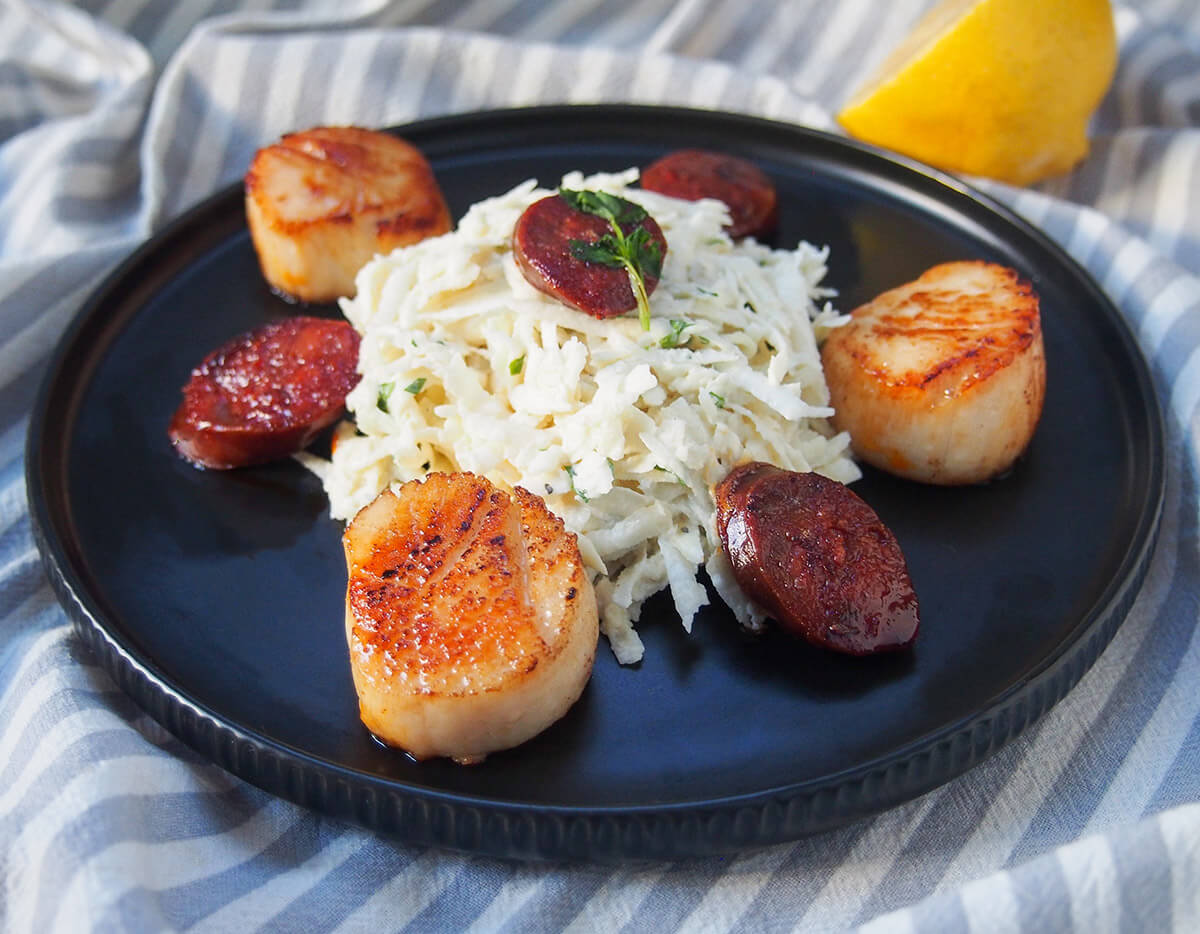 plate of celeriac remoulade seared scallops and chorizo