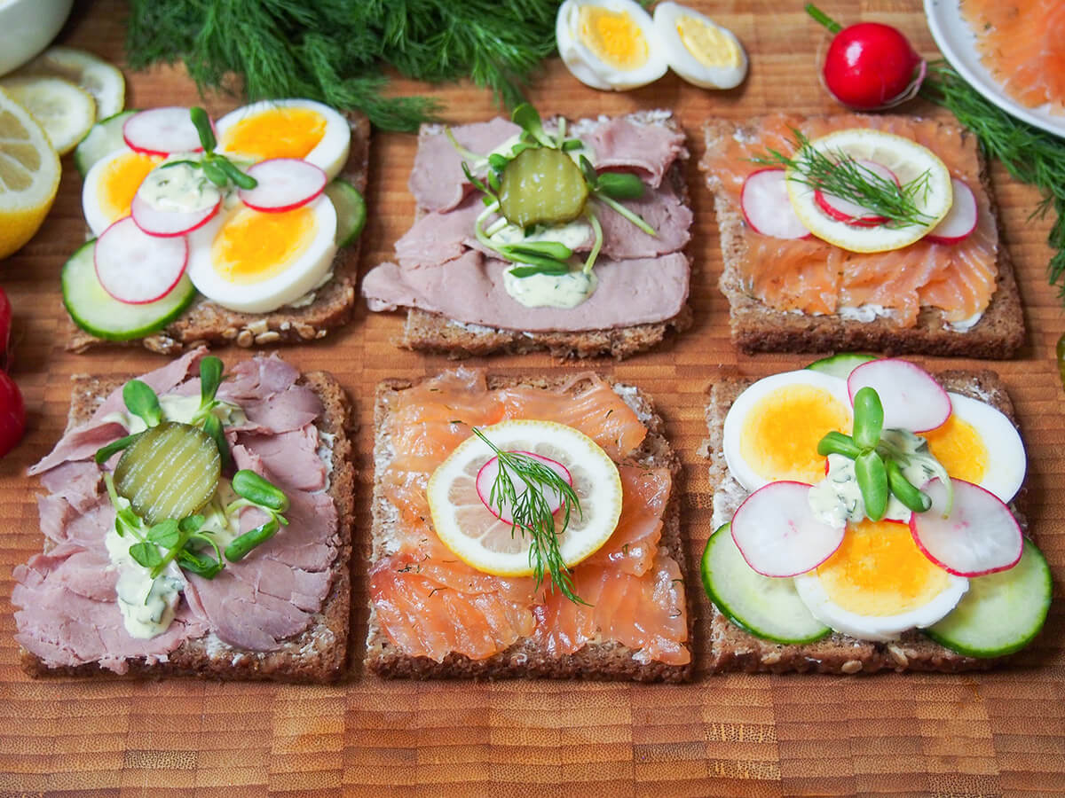 six Danish open sandwiches smorrebrod in two rows with three different toppings