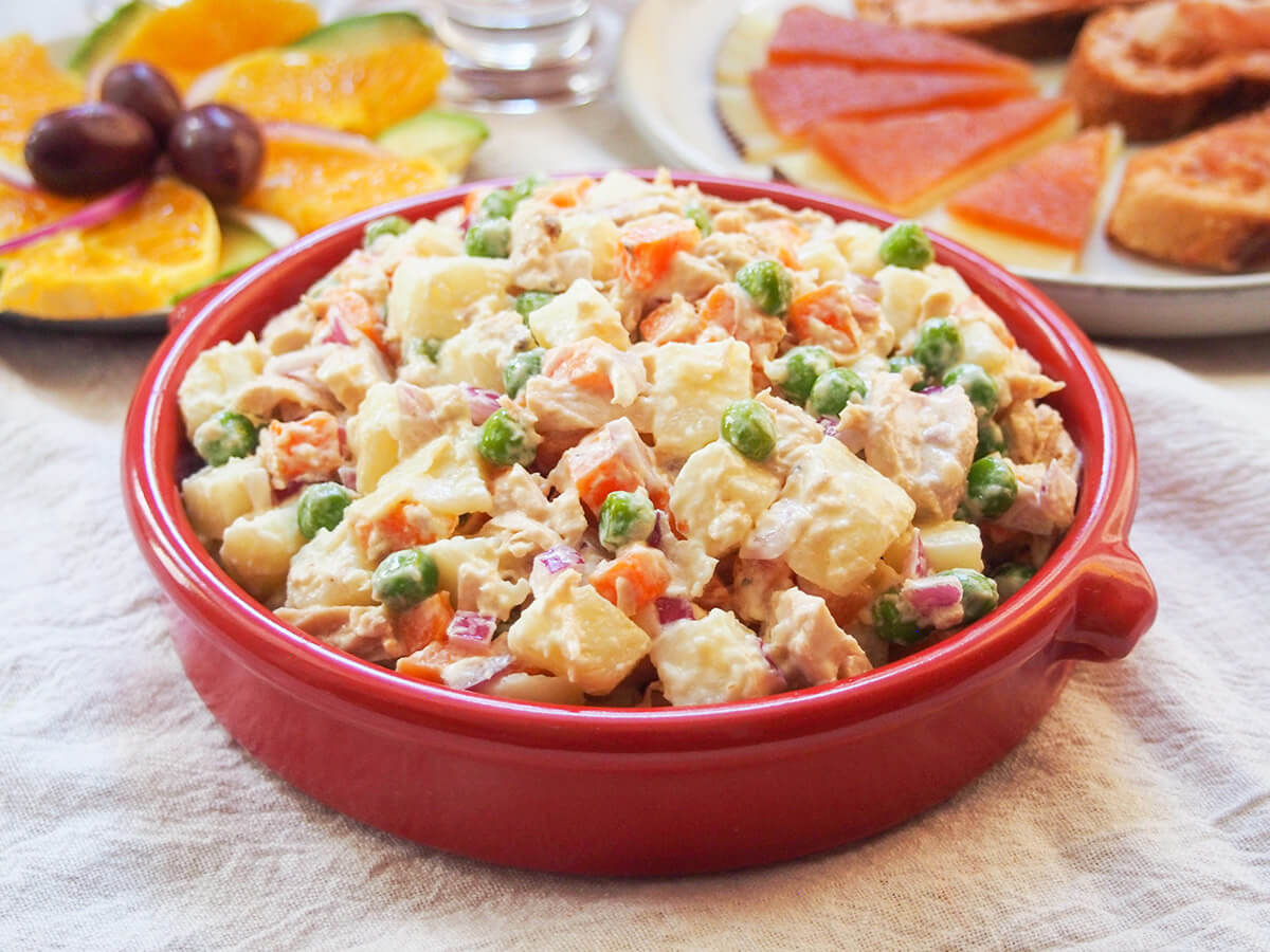 terracotta dish of ensaladilla rusa Spanish potato salad