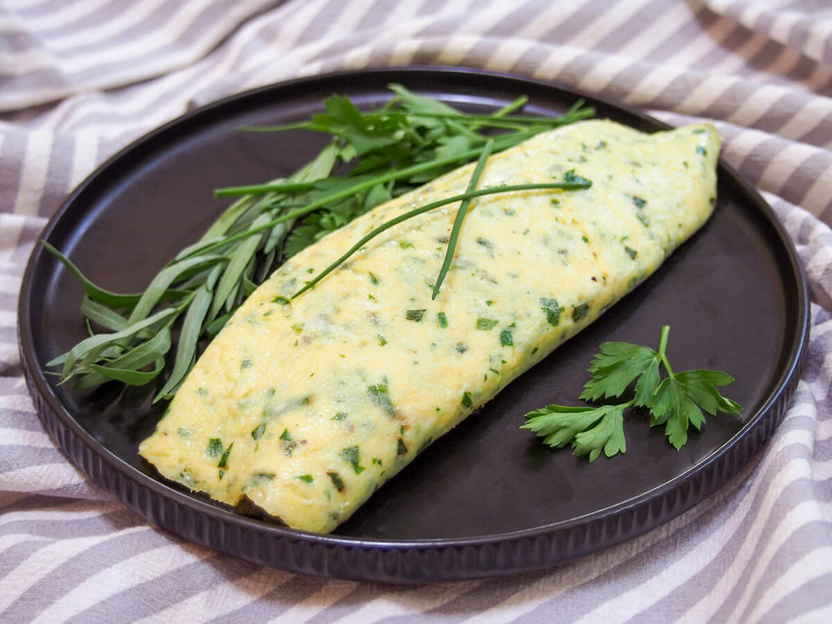 French omelette with herbs on plate