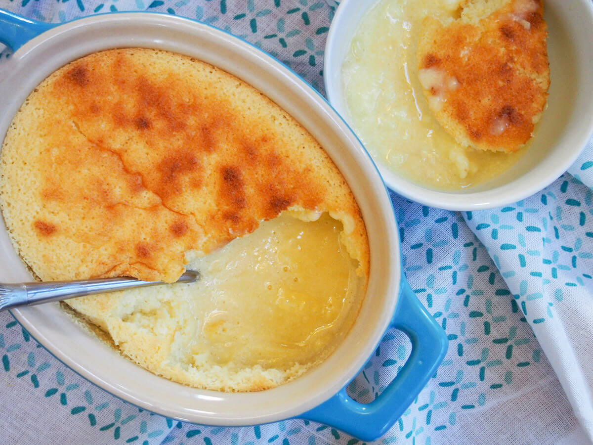 lemon pudding cake in dish with bowl with some to side