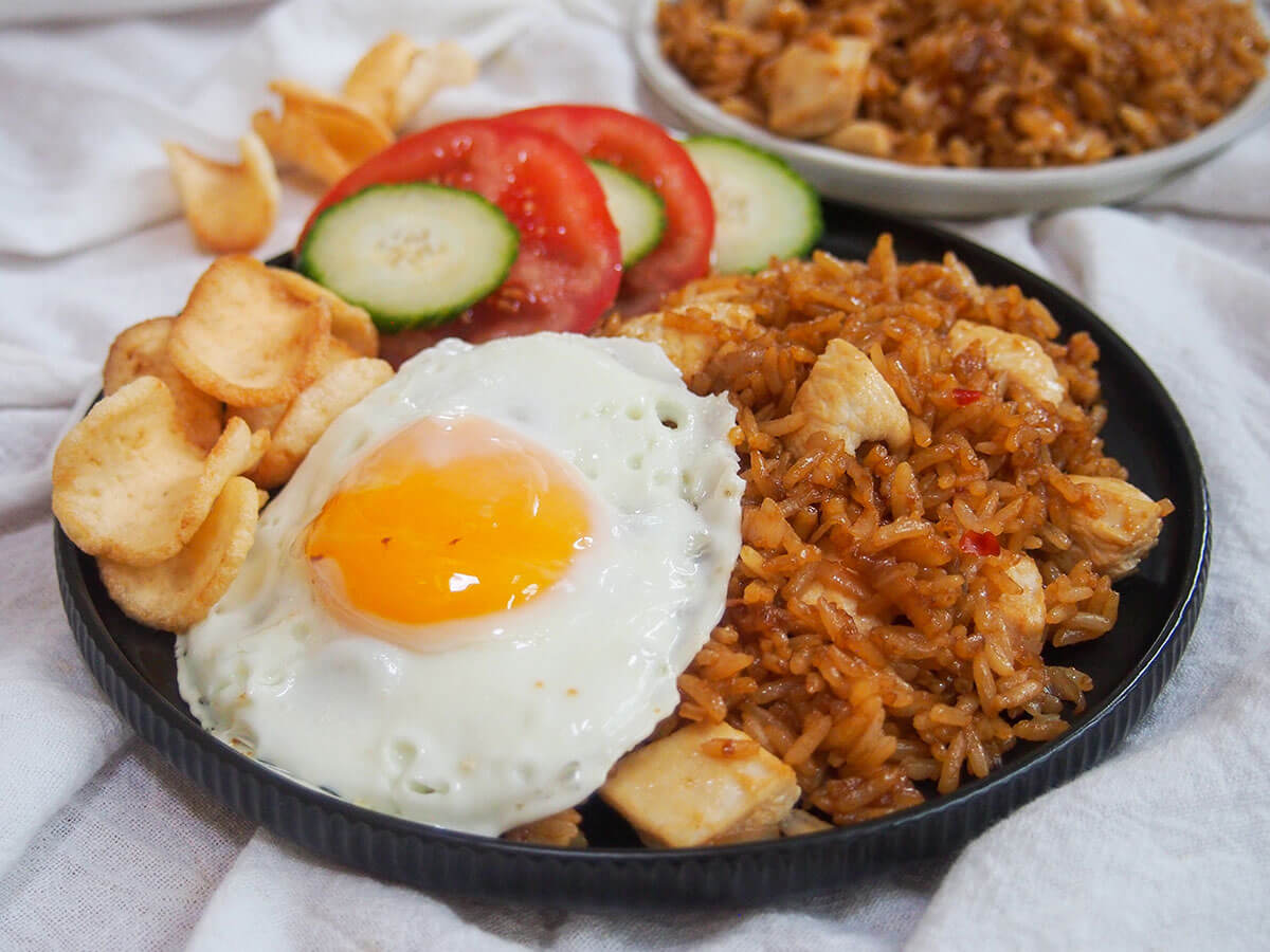 plate of nasi goreng Indonesian fried rice with fried egg to one side