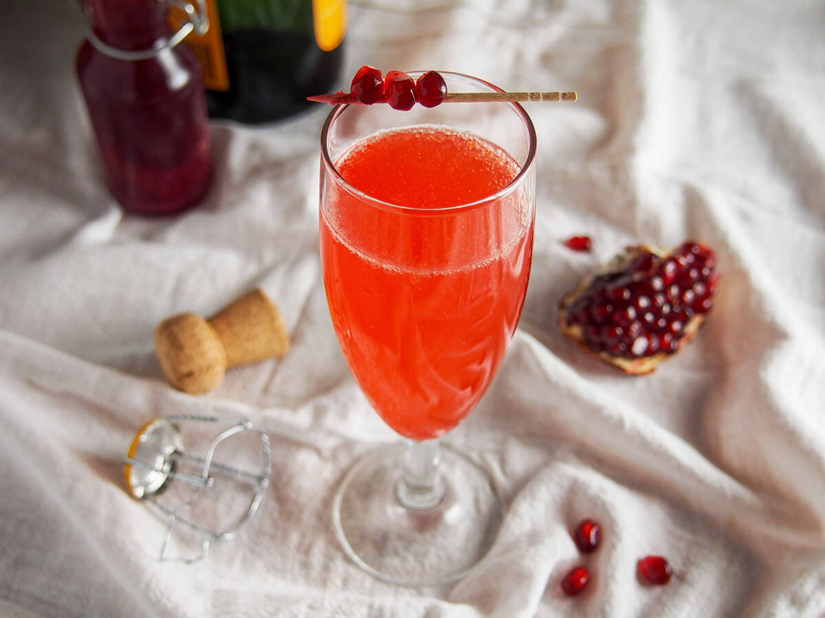 glass of pomegranate French 75