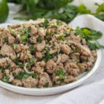 side view of plate of pork larb