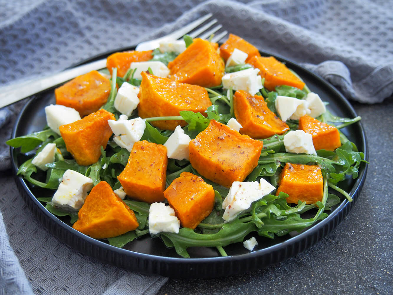 plate of roasted kabocha squash salad with feta