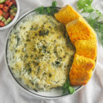 plate of Persian herb rice with fish, sabzi polow mahi from overhead