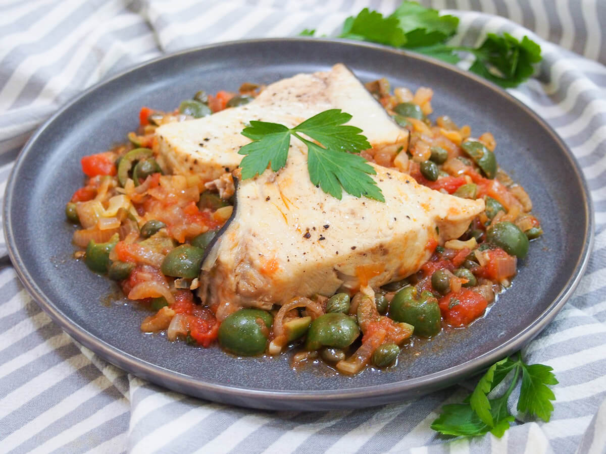 plate of Sicilian swordfish with olives and capers