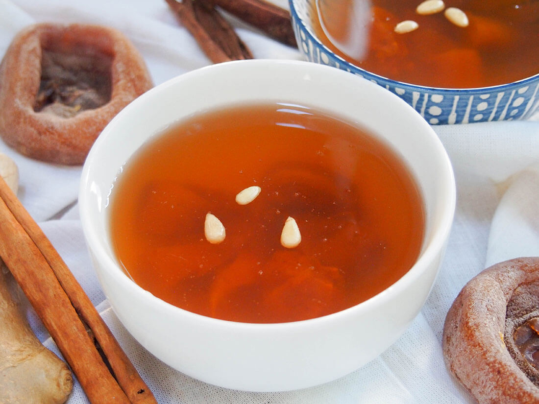 Sujeonggwa (Korean cinnamon tea) in bowl