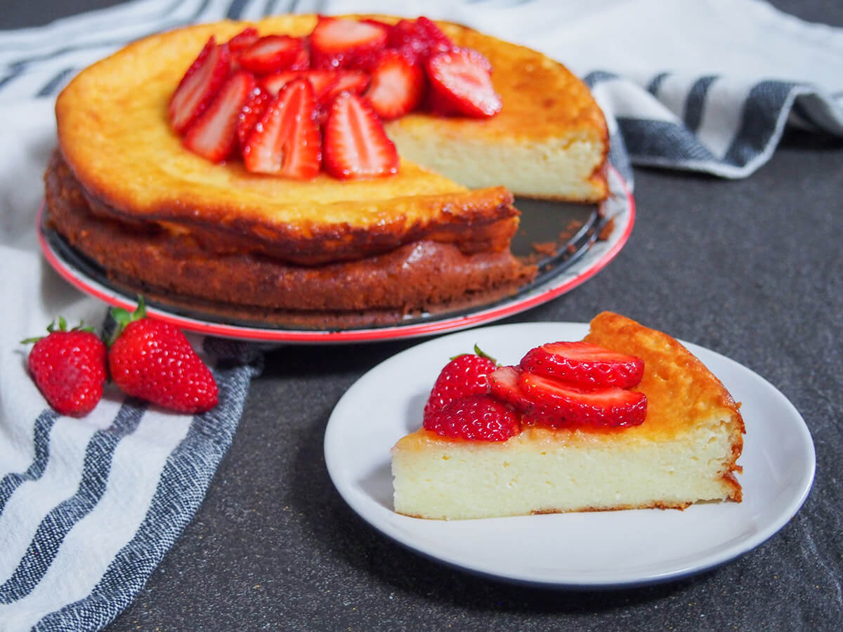 plate with slice of Swedish cheesecake in front of rest of cheesecake