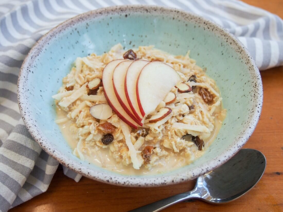 bowl of Swiss Bircher muesli with spoon under bowl