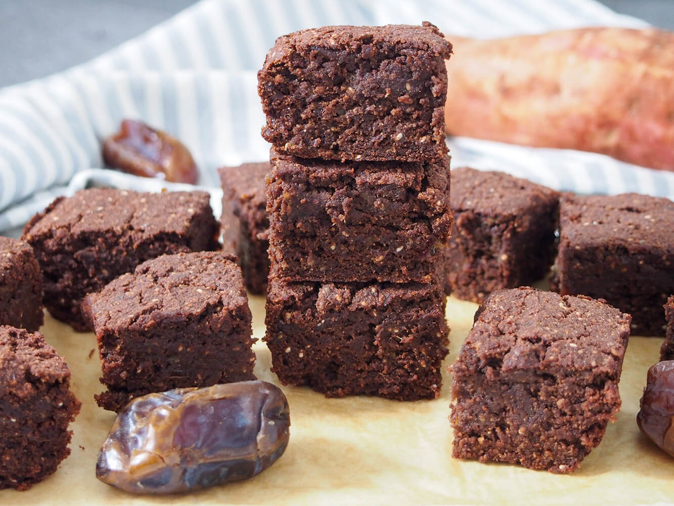 vegan sweet potato brownies with some in stack and others to side